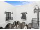 Stunning courtyard with checkerboard flooring, arched walkways, and ornate lighting at 3482 Flamingo Ave, Sarasota, FL 34242