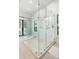 Large walk-in shower with glass enclosure and marble tile at 3482 Flamingo Ave, Sarasota, FL 34242