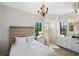 Main bedroom with a queen bed, walk-in shower and double vanity at 3482 Flamingo Ave, Sarasota, FL 34242