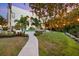 Landscaped pathway leading to a tranquil backyard at 3482 Flamingo Ave, Sarasota, FL 34242