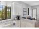 Modern white kitchen with stainless steel appliances and marble countertops at 3482 Flamingo Ave, Sarasota, FL 34242