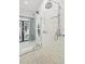 Spacious walk-in shower with double shower heads and marble tile at 3482 Flamingo Ave, Sarasota, FL 34242