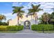 Modern home exterior with arched entryway and lush landscaping at 3482 Flamingo Ave, Sarasota, FL 34242