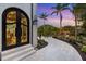 Ornate iron doors leading to a beautifully landscaped walkway at 3482 Flamingo Ave, Sarasota, FL 34242