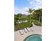 Expansive pool and patio overlooking the water at 3482 Flamingo Ave, Sarasota, FL 34242