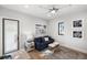 Small living area with sofa, side table and a view to backyard at 3482 Flamingo Ave, Sarasota, FL 34242