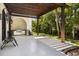 Outdoor patio with built-in grill, pergola, and lush landscaping at 3482 Flamingo Ave, Sarasota, FL 34242