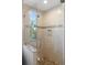 Spa-like bathroom with a glass shower and pebble floor at 3482 Flamingo Ave, Sarasota, FL 34242