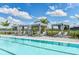 Relaxing pool area with striped cabanas and lounge chairs at 17938 Palmiste Dr, Bradenton, FL 34202