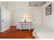 Bedroom with hardwood floors and a console table at 1206 86Th Nw Ct, Bradenton, FL 34209