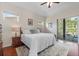 Spacious main bedroom with wood floors and access to the pool area at 1206 86Th Nw Ct, Bradenton, FL 34209