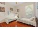 Two twin beds in a sunny bedroom with hardwood floors at 1206 86Th Nw Ct, Bradenton, FL 34209