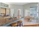 Kitchen with granite island, breakfast bar, and views to the Gathering room at 1206 86Th Nw Ct, Bradenton, FL 34209