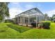 Large backyard with screened pool and patio area at 1206 86Th Nw Ct, Bradenton, FL 34209