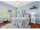Large bedroom with king-size bed and wood flooring at 1206 86Th Nw Ct, Bradenton, FL 34209