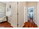 Bright hallway with hardwood floors and access to bedrooms at 1206 86Th Nw Ct, Bradenton, FL 34209