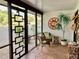 Cozy screened patio with wicker furniture at 3500 El Conquistador Pkwy # 307, Bradenton, FL 34210