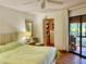 Main bedroom with a walk-in closet and patio access at 3500 El Conquistador Pkwy # 307, Bradenton, FL 34210