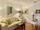 Living room with a comfy sofa, two armchairs, and hexagonal tile floors at 3500 El Conquistador Pkwy # 307, Bradenton, FL 34210