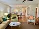 Open living room and kitchen with a dining area at 3500 El Conquistador Pkwy # 307, Bradenton, FL 34210
