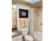 Clean bathroom with shower/tub combo, granite vanity, and striped shower curtain at 3500 El Conquistador Pkwy # 307, Bradenton, FL 34210