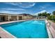 Inviting community pool with lounge chairs and covered seating areas at 6428 Fleetwood Ct, North Port, FL 34287