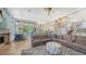 Open living space with sectional sofa, fireplace and views to the kitchen and pool at 549 Sloop Ln, Longboat Key, FL 34228