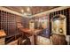 Impressive wine cellar with wooden racks and wine cooler at 549 Sloop Ln, Longboat Key, FL 34228