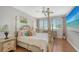 Bedroom with a four-poster bed and a large TV at 549 Sloop Ln, Longboat Key, FL 34228