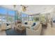 Spacious living room with vaulted ceilings, fireplace, and large windows at 549 Sloop Ln, Longboat Key, FL 34228