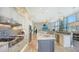 Open concept kitchen with large island, stainless steel appliances, and custom cabinetry at 549 Sloop Ln, Longboat Key, FL 34228