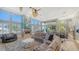 Open living space featuring a sectional sofa, fireplace and access to the kitchen at 549 Sloop Ln, Longboat Key, FL 34228