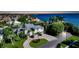 Luxury waterfront home with lush landscaping and bay views at 549 Sloop Ln, Longboat Key, FL 34228