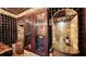 Wine cellar with a large wine cooler and barrel at 549 Sloop Ln, Longboat Key, FL 34228