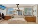 Elegant bathroom with a large soaking tub, double vanities, and chandelier at 549 Sloop Ln, Longboat Key, FL 34228