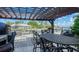 Outdoor patio with pergola, table, and chairs at 549 Sloop Ln, Longboat Key, FL 34228