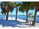 Peaceful waterfront view with palm trees and informational signage at 549 Sloop Ln, Longboat Key, FL 34228