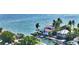 Waterfront home with private dock and lush landscaping at 549 Sloop Ln, Longboat Key, FL 34228