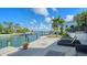 Backyard oasis with lounge chairs and waterfront views at 549 Sloop Ln, Longboat Key, FL 34228