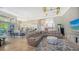 Open concept living area with sectional sofa and views of the kitchen and pool at 549 Sloop Ln, Longboat Key, FL 34228