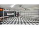 Garage with a black and white checkered floor at 549 Sloop Ln, Longboat Key, FL 34228