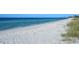 Scenic beach view with white sand and turquoise water at 549 Sloop Ln, Longboat Key, FL 34228