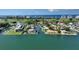 Aerial view of waterfront home with private dock at 549 Sloop Ln, Longboat Key, FL 34228
