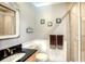 Small bathroom with shower and granite countertop at 549 Sloop Ln, Longboat Key, FL 34228
