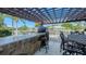 Outdoor kitchen with stone bar and pizza oven at 549 Sloop Ln, Longboat Key, FL 34228