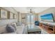 Comfortable Gathering room with plush sofa, large TV, and access to patio at 549 Sloop Ln, Longboat Key, FL 34228