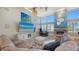 Living room with sectional sofa, large TV, and coastal decor at 549 Sloop Ln, Longboat Key, FL 34228