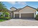 Beautiful two-story home with stone and stucco exterior at 13108 Swiftwater Way, Bradenton, FL 34211