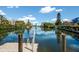 Scenic canal view with private dock and lush landscaping at 3705 E Bay Dr # 115, Holmes Beach, FL 34217