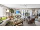 Living room with balcony access and ample natural light at 1477 Park Beach Cir # 13, Punta Gorda, FL 33950